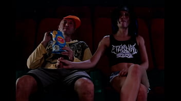 A Steamy Public Handjob In The Dark Of The Movie Theatre