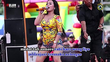 Two Stunning Singers Writhe And Tease On Stage, Encircled By A Crowd Of Lustful Men.