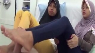 Two Teen Girls’ Steamy Footjob Session
