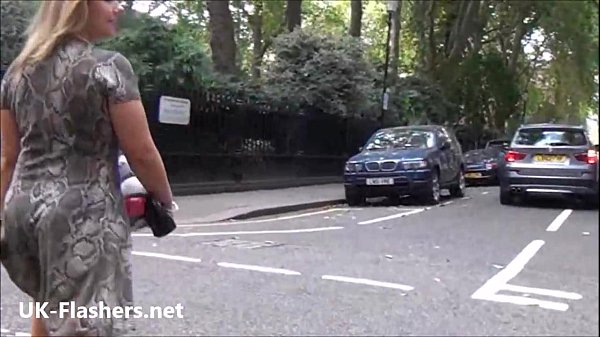 Exhibitionist Blonde Ashley Riders Flaunts Her Bare Skin For A Public Audience In This Raw Outdoor Voyeur Scene.
