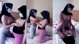 Lesbian Couple In Hijabs Caressing Each Other’s Breasts